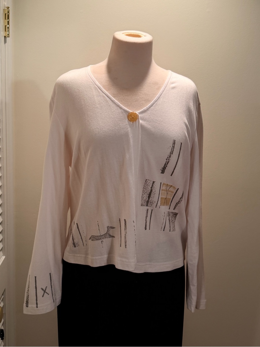 Cream Long-Sleeve V-Neck Tee with Subtle Graphic Accents